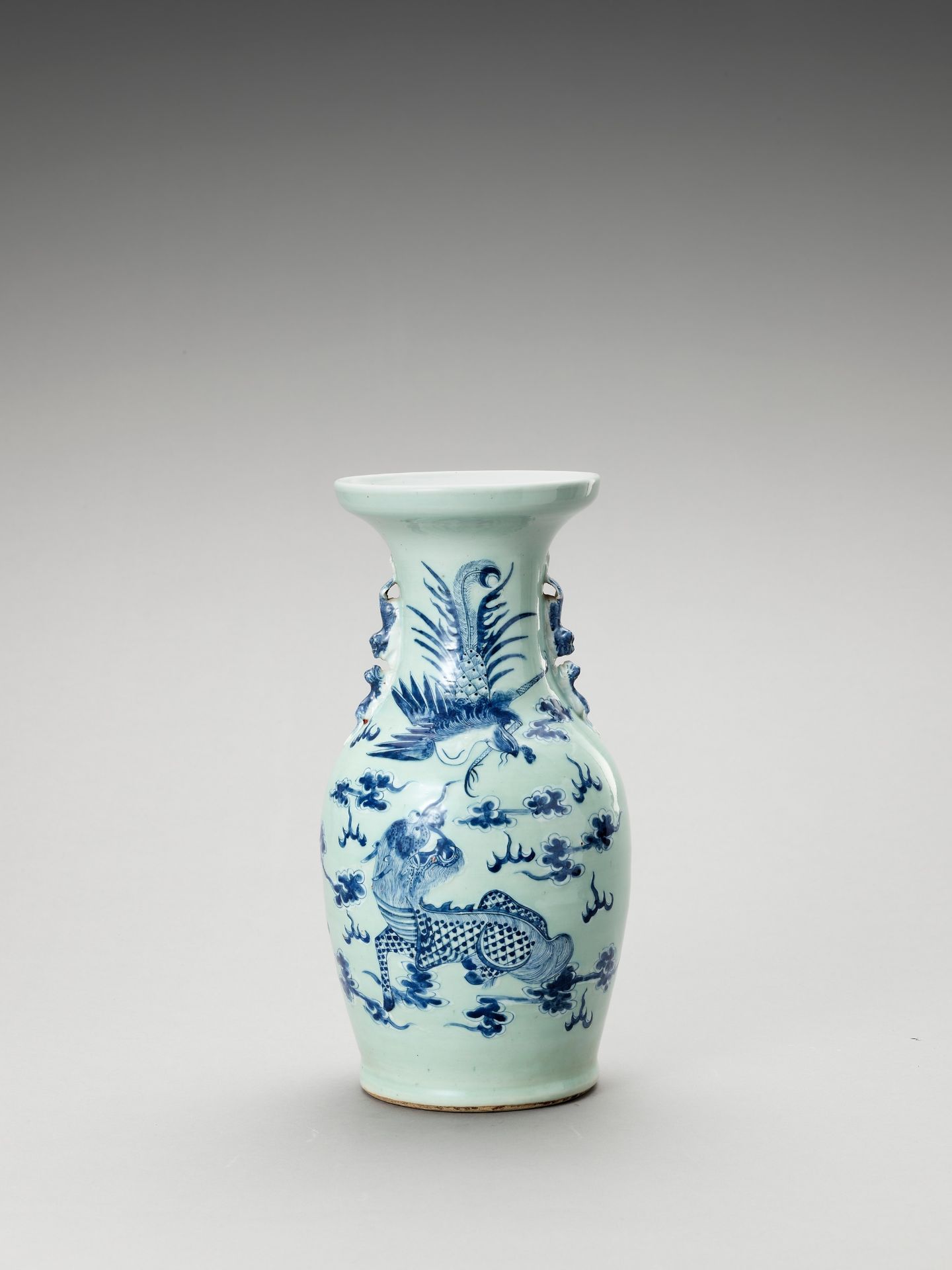 A BLUE AND WHITE CELADON-GLAZED 'QILIN AND PHOENIX' VASE, LATE QING