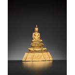 A 24-CARAT GOLD REPOUSSE FIGURE OF BUDDHA SHAKYAMUNI, AYUTTHAYA STYLE