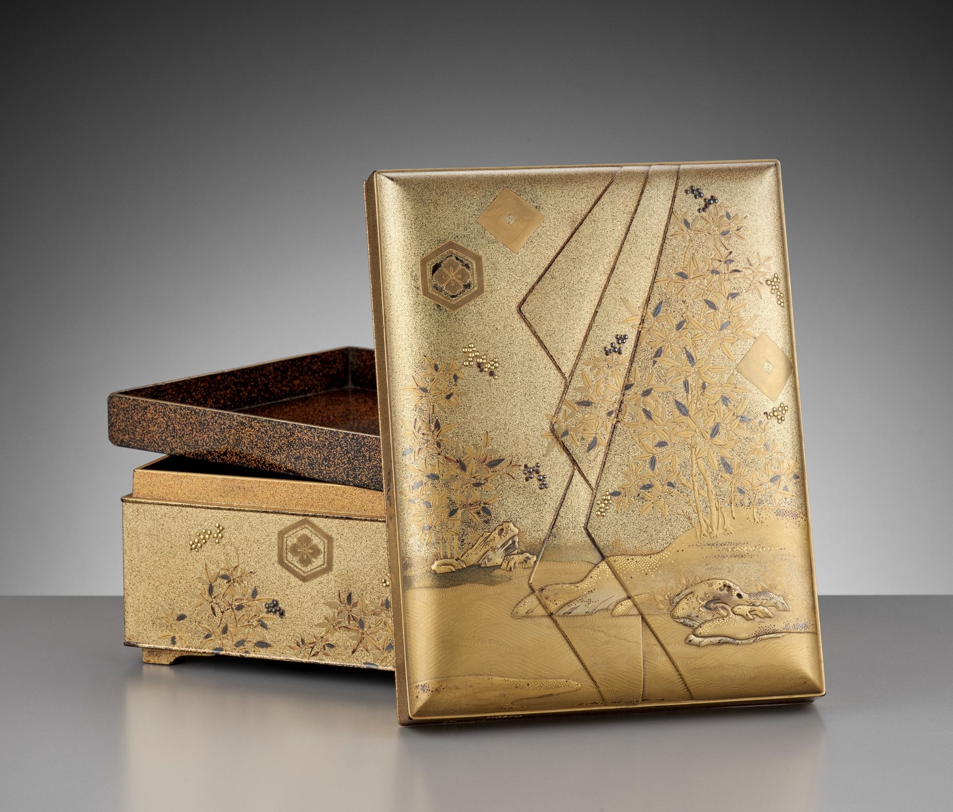 A LACQUER TEBAKO DEPICTING A LANDSCAPE WITH BAMBOO