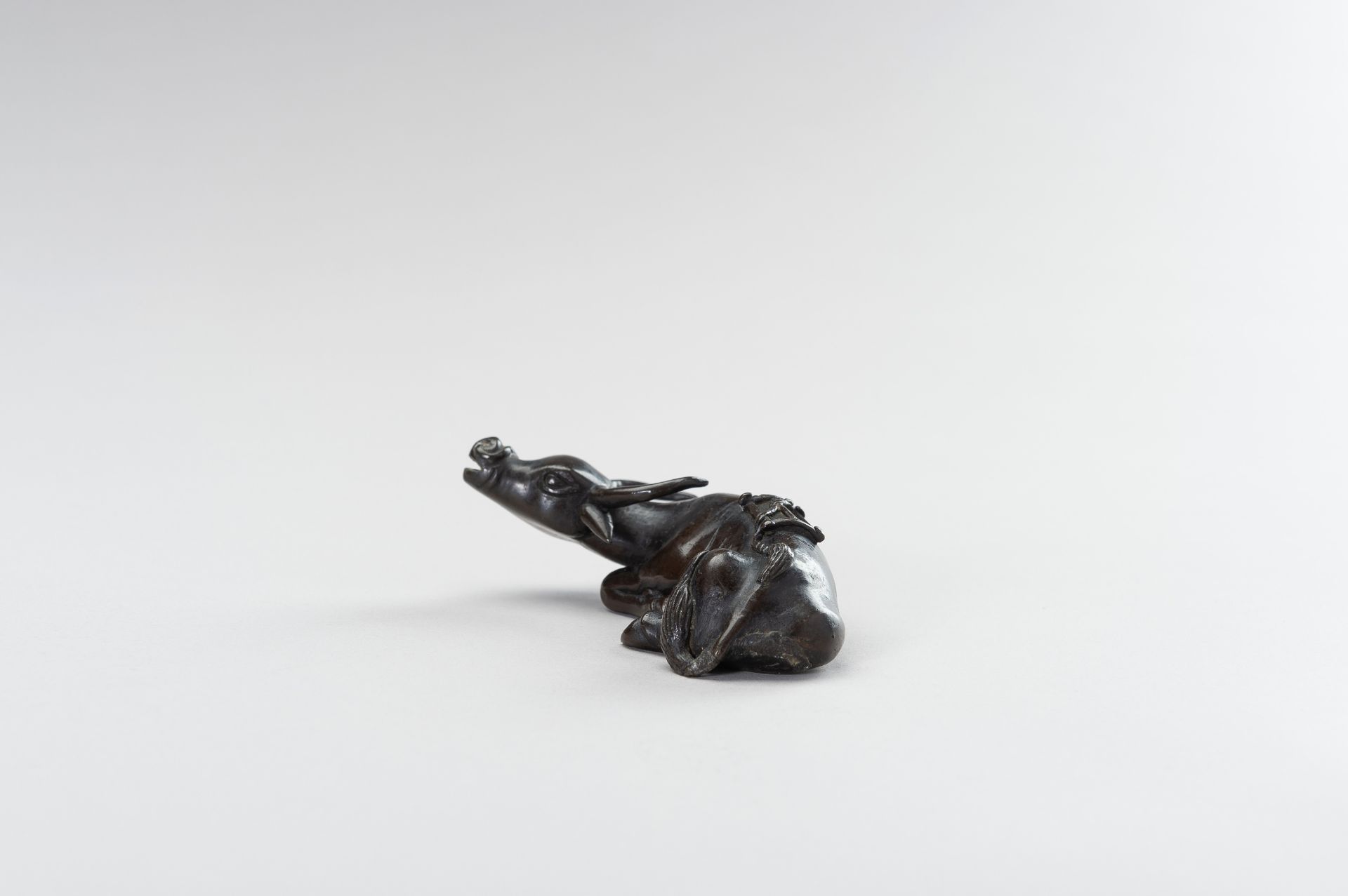 A CHINESE BRONZE FIGURE OF A TAMED WATER BUFFALO - Image 4 of 11