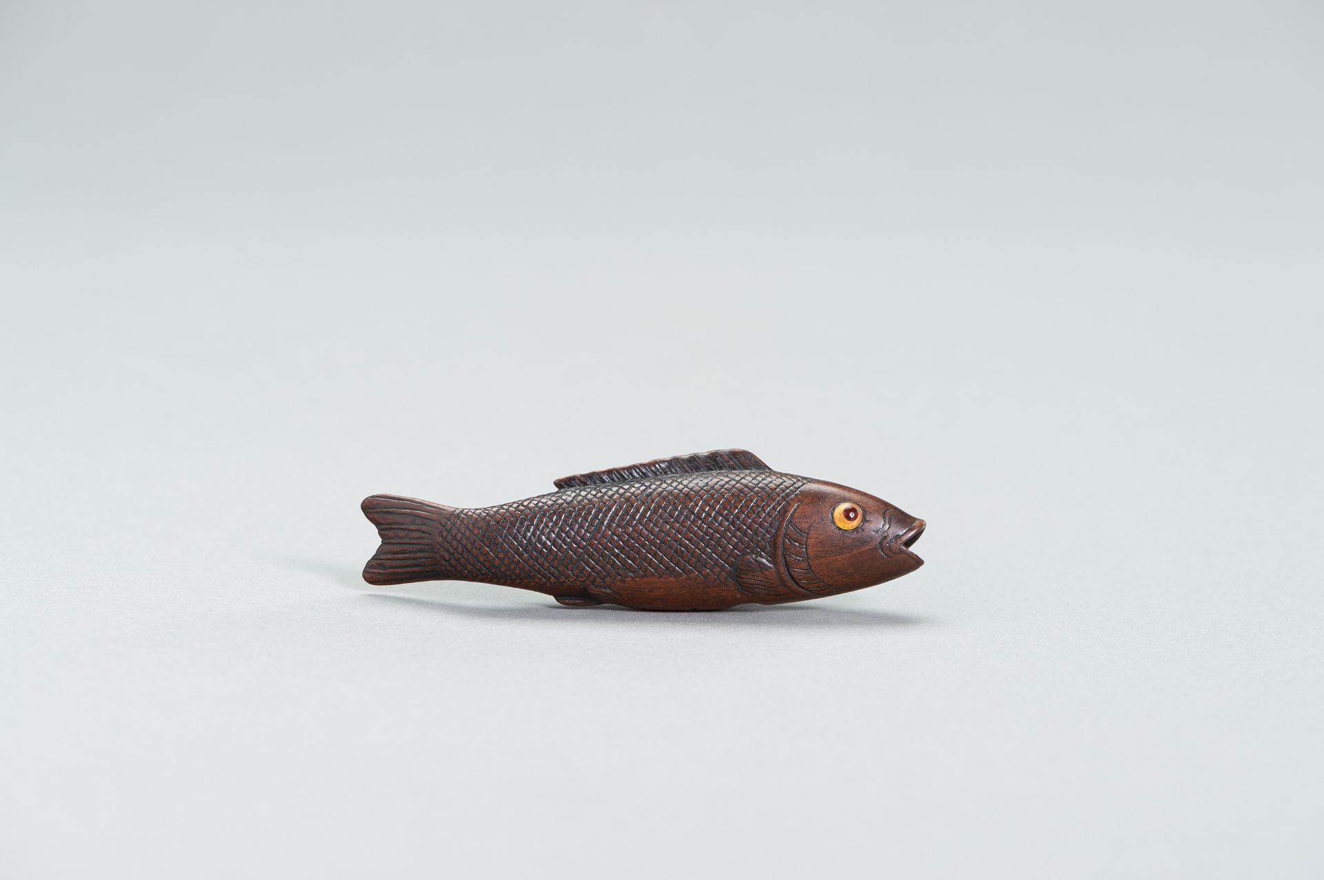 A LARGE WOOD FISH NETSUKE