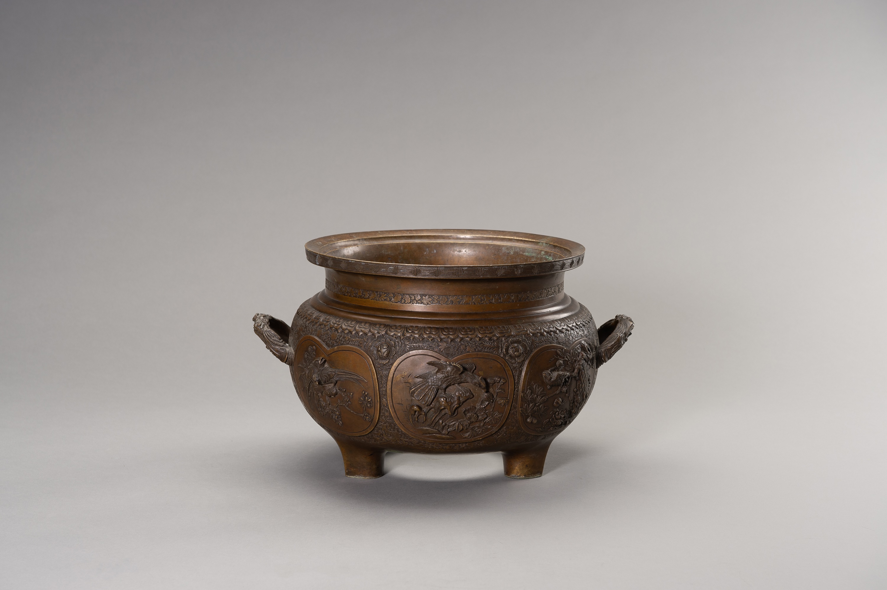 A LARGE AND HEAVY BRONZE TRIPOD CENSER