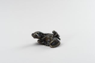 A FIGURAL BRONZE PAPERWEIGHT IN THE SHAPE OF A WATER BUFFALO AND HERDER