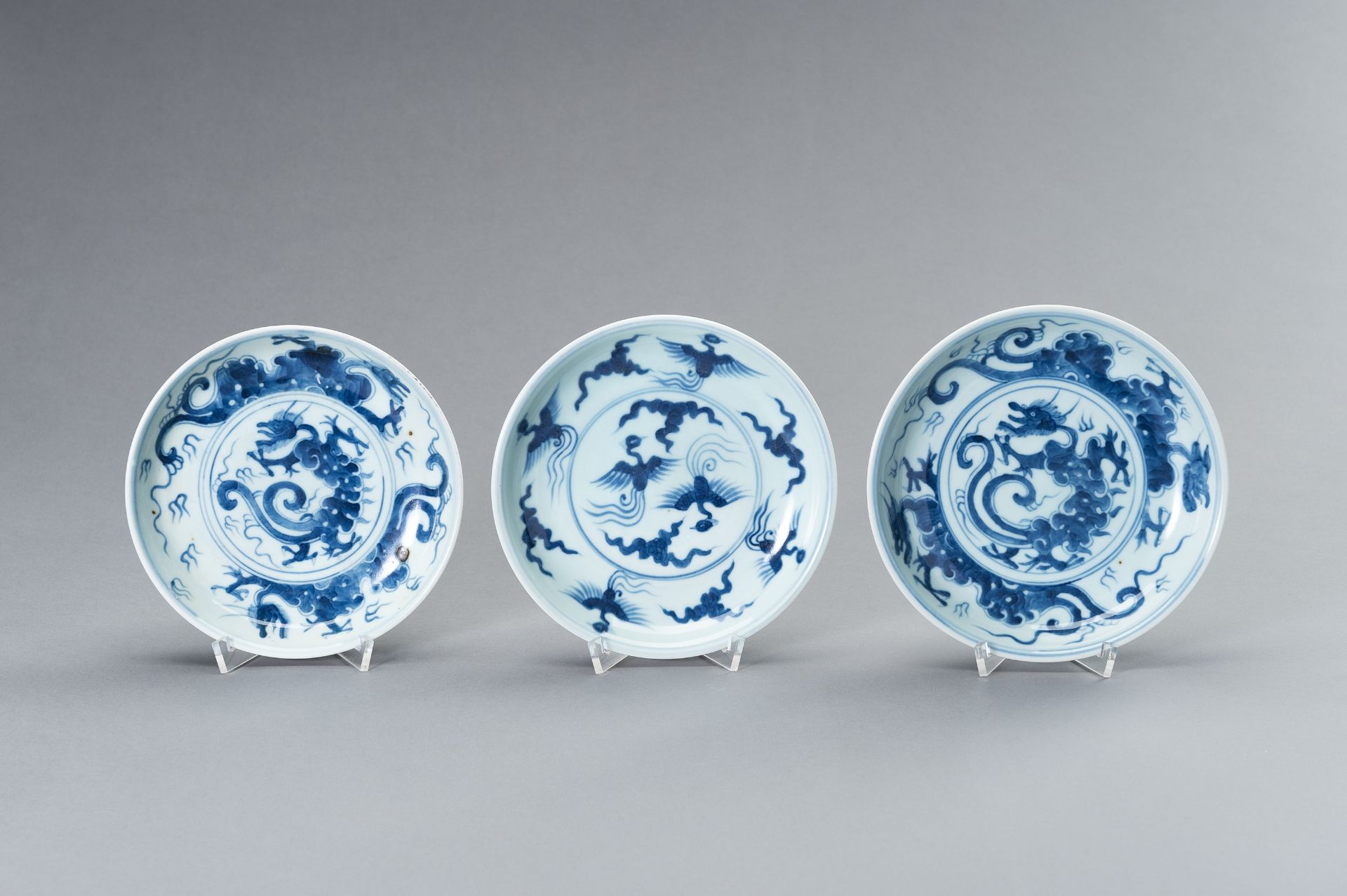 THREE SMALL 'DRAGON AND PHOENIX' PORCELAIN DISHES