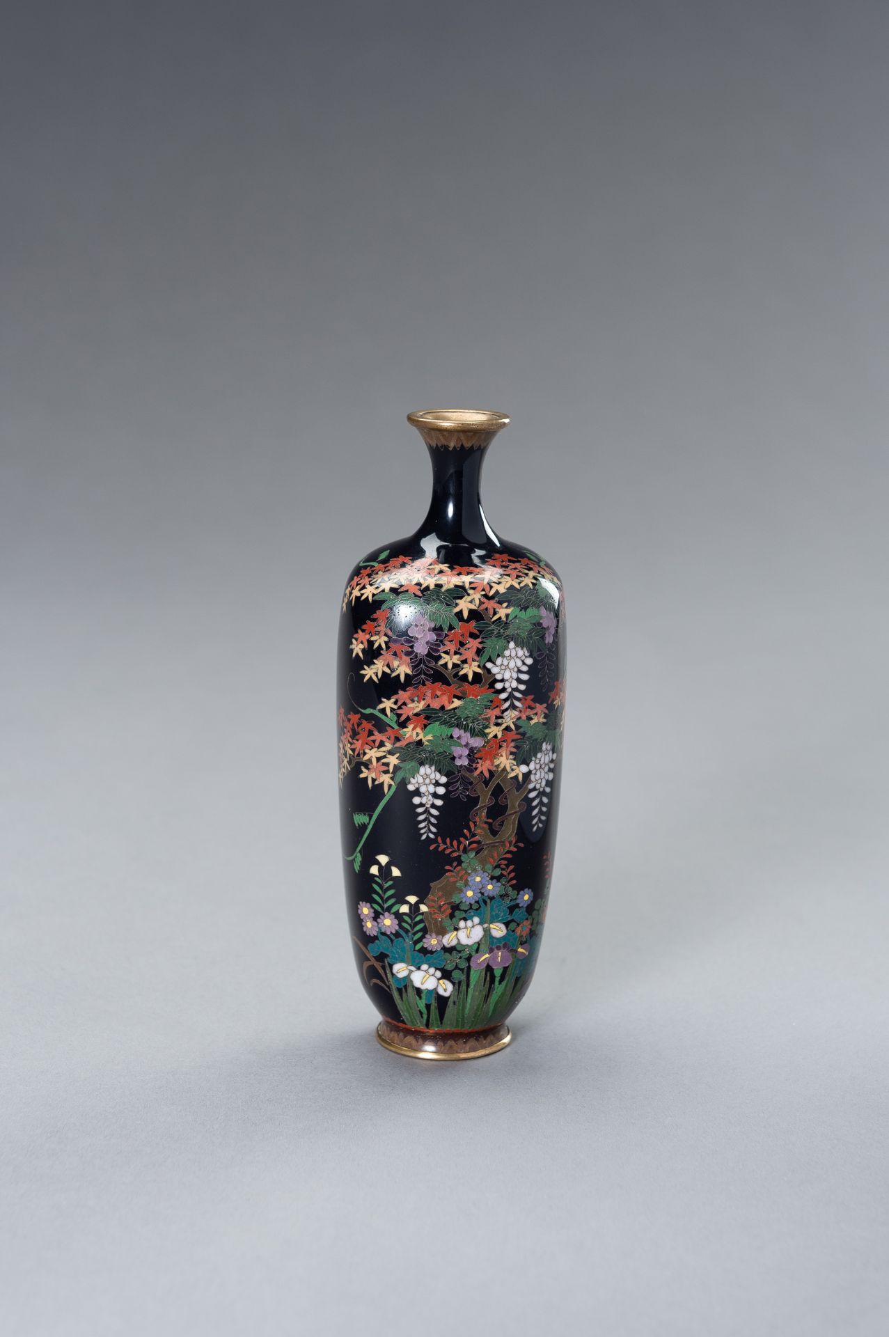 A CLOISONNE VASE WITH A MAPLE TREE AND FLOWERS