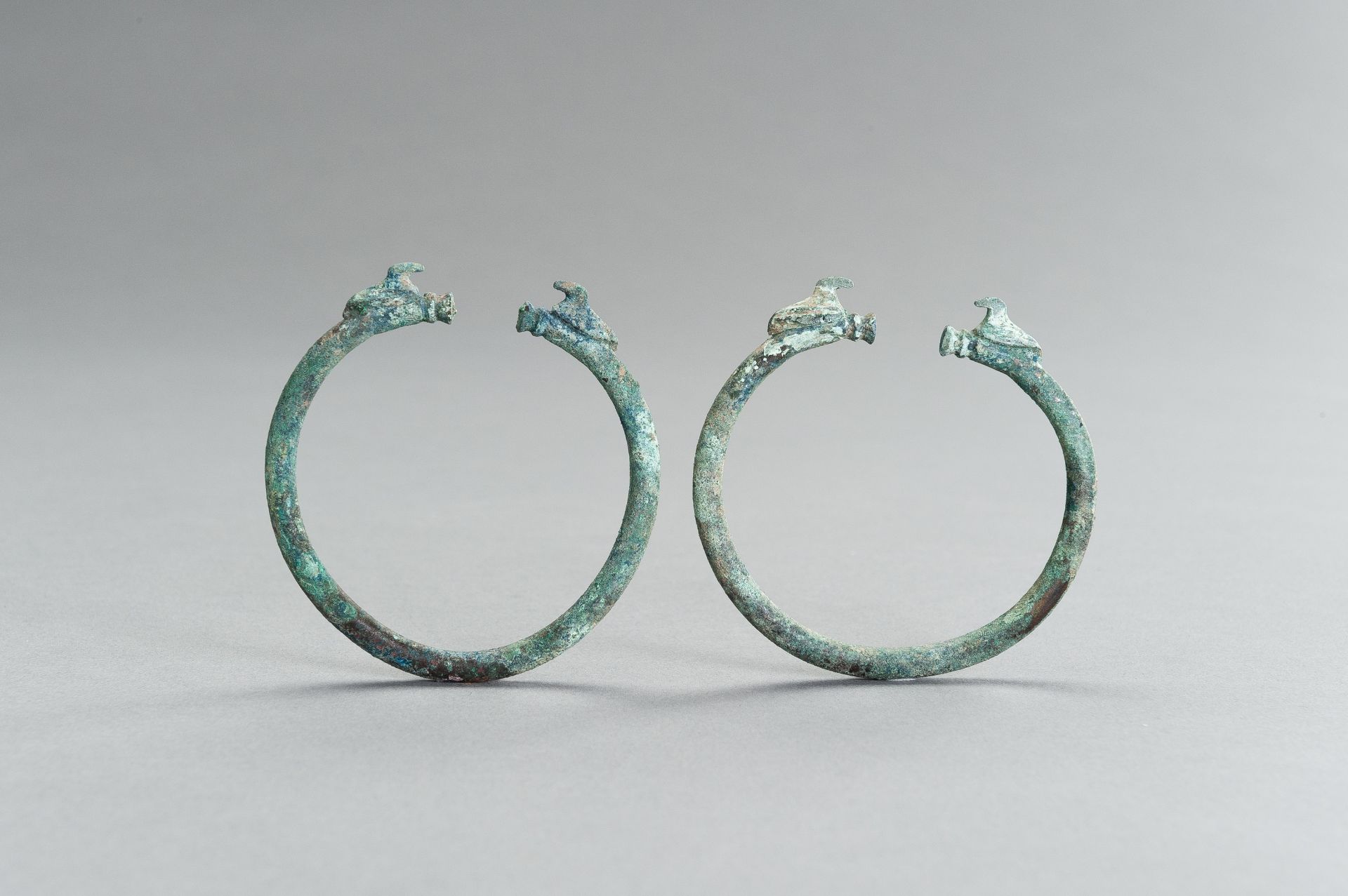 A PAIR OF BRONZE BRACELETS