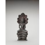 A KHMER STYLE BRONZE OF BUDDHA MUCHALINDA