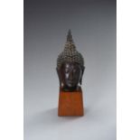 A SUKHOTAI STYLE BRONZE HEAD OF A BUDDHA