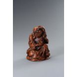 A BAMBOO FIGURE OF UNHAPPY LUCKY BUDDHA