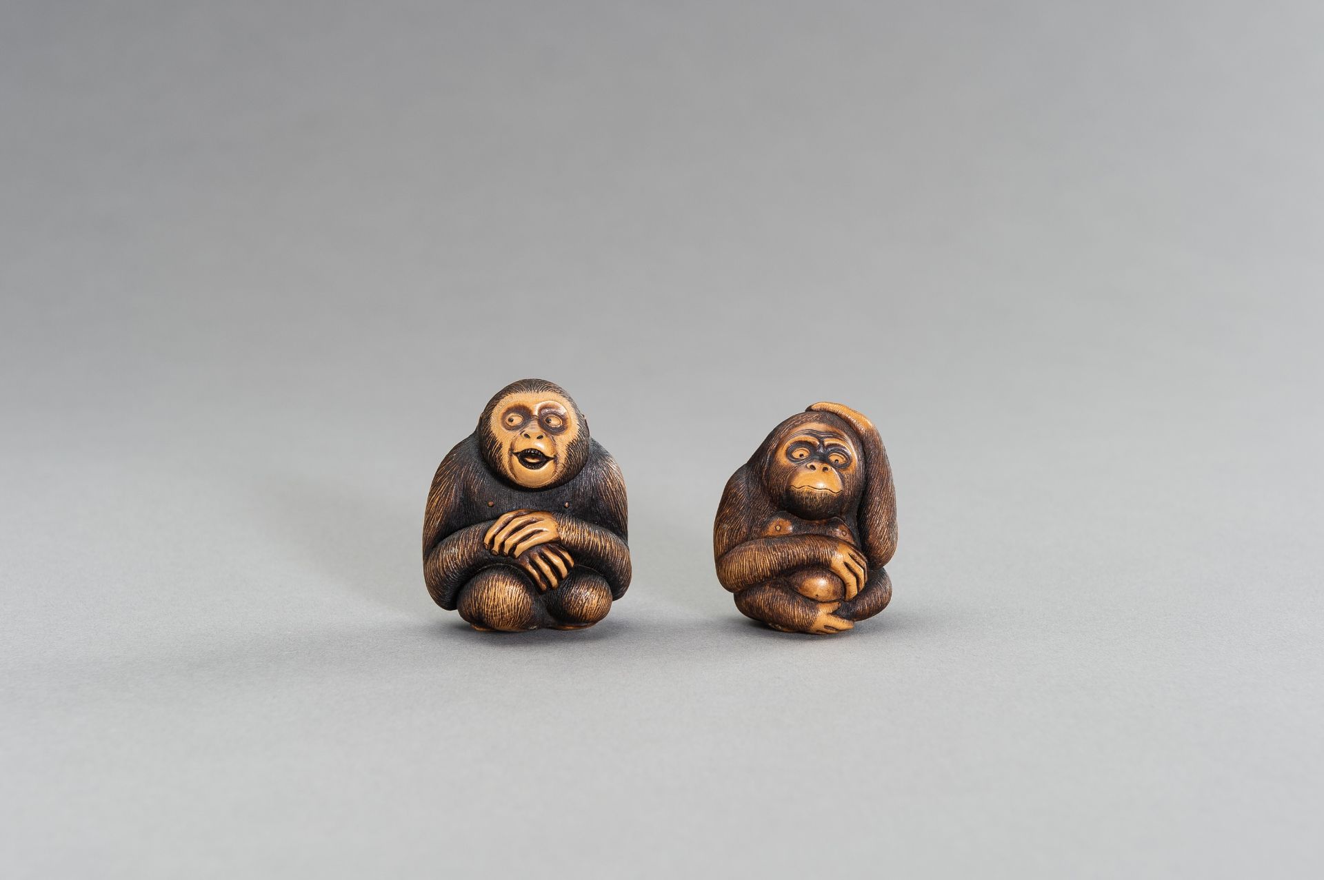 TWO CONTEMPORARY BOXWOOD NETSUKE OF MONKEYS