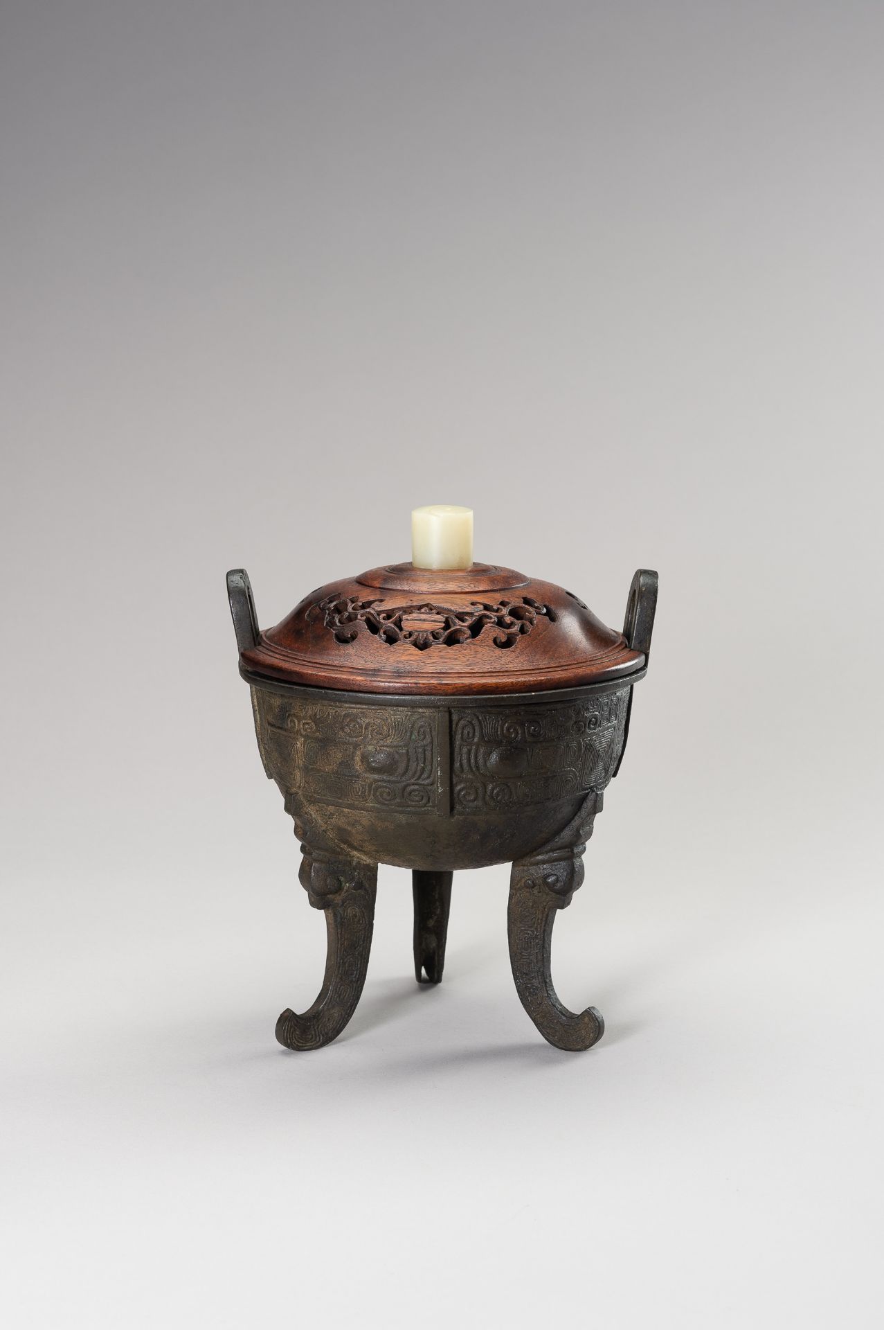 AN ARCHAISTIC DING-FORM BRONZE TRIPOD CENSER - Image 6 of 11