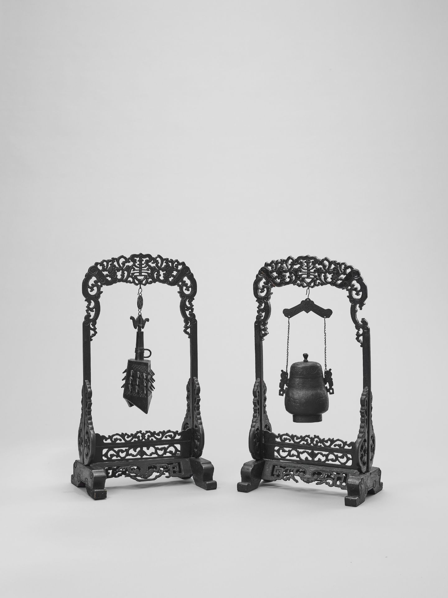 AN ARCHAISTIC BRONZE TEMPLE BELL AND VESSEL SUSPENDED IN HARDWOOD FRAMES AND STANDS, QING