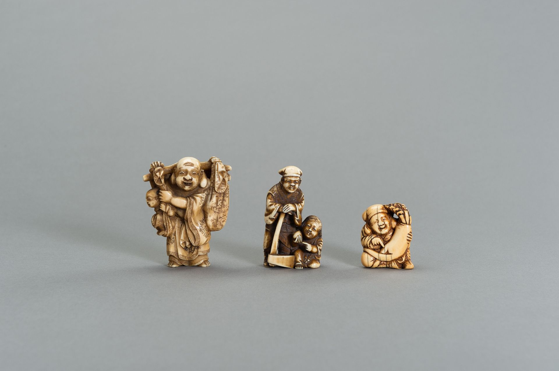 A GROUP OF THREE TOMOCHIKA SCHOOL IVORY NETSUKE