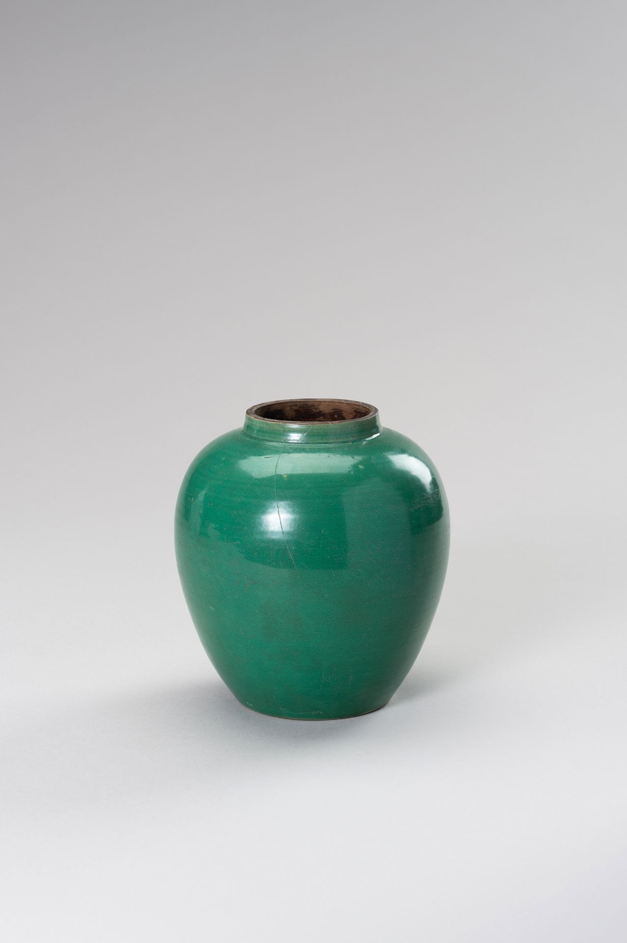 A GREEN GLAZED PORCELAIN JAR