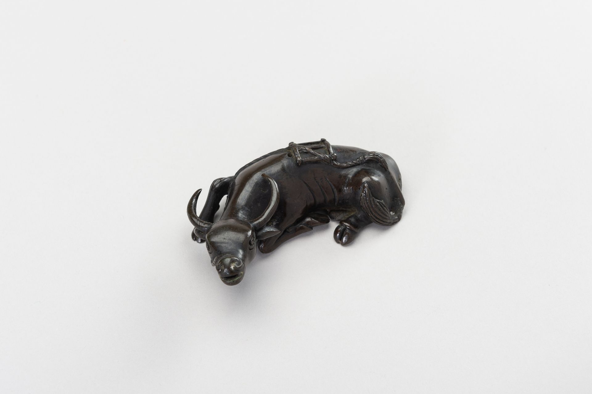 A CHINESE BRONZE FIGURE OF A TAMED WATER BUFFALO - Image 9 of 11