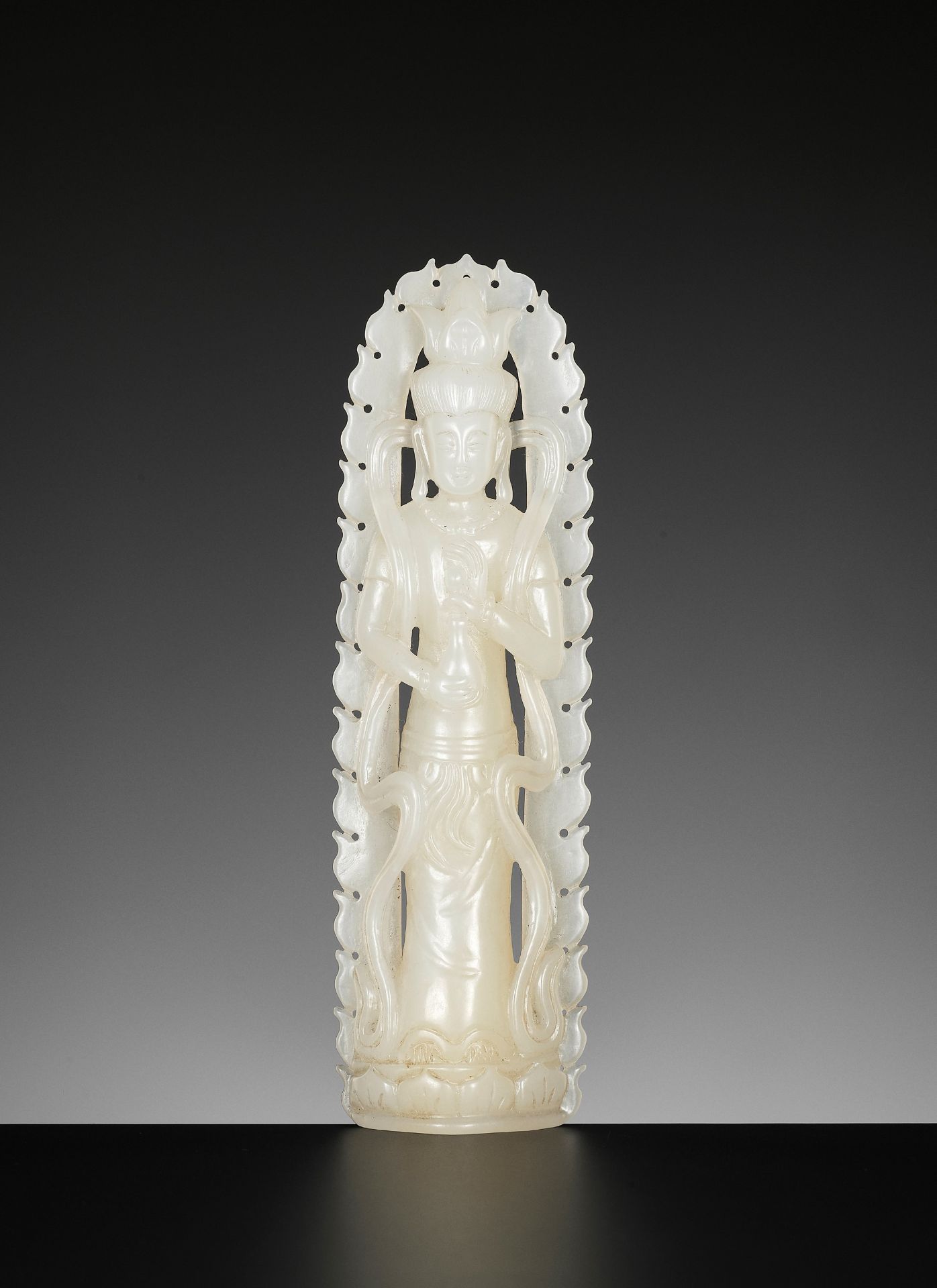A WHITE JADE FIGURE OF GUANYIN, LATE QING TO REPUBLIC