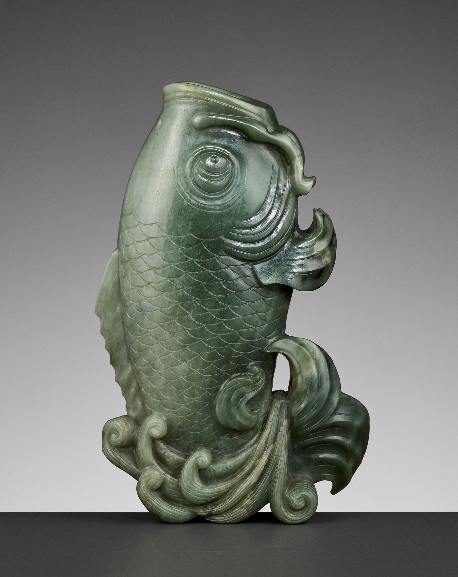 A GREEN JADE 'CARP' VASE, QING DYNASTY