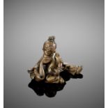 A FIGURAL BRONZE SCROLL WEIGHT, MING DYNASTY