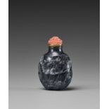 A SUZHOU SCHOOL BLACK AND WHITE JADE SNUFF BOTTLE, QING DYNASTY