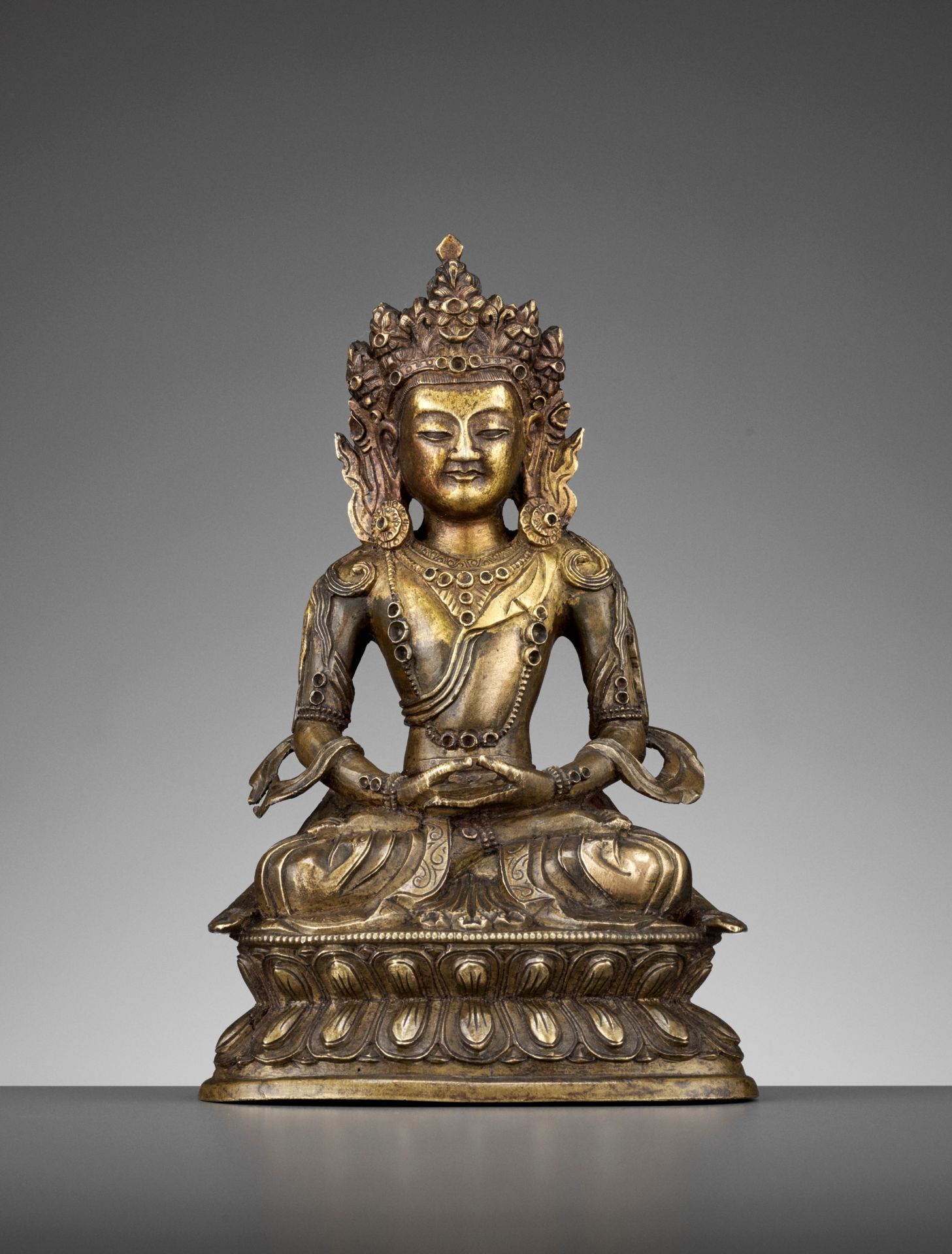 A GILT BRONZE FIGURE OF AMITAYUS, MID-QING