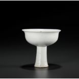 A WHITE GLAZED ANHUA DECORATED STEM CUP, YUAN DYNASTY