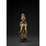 A GILT-BRONZE FIGURE OF A LADY, MING DYNASTY