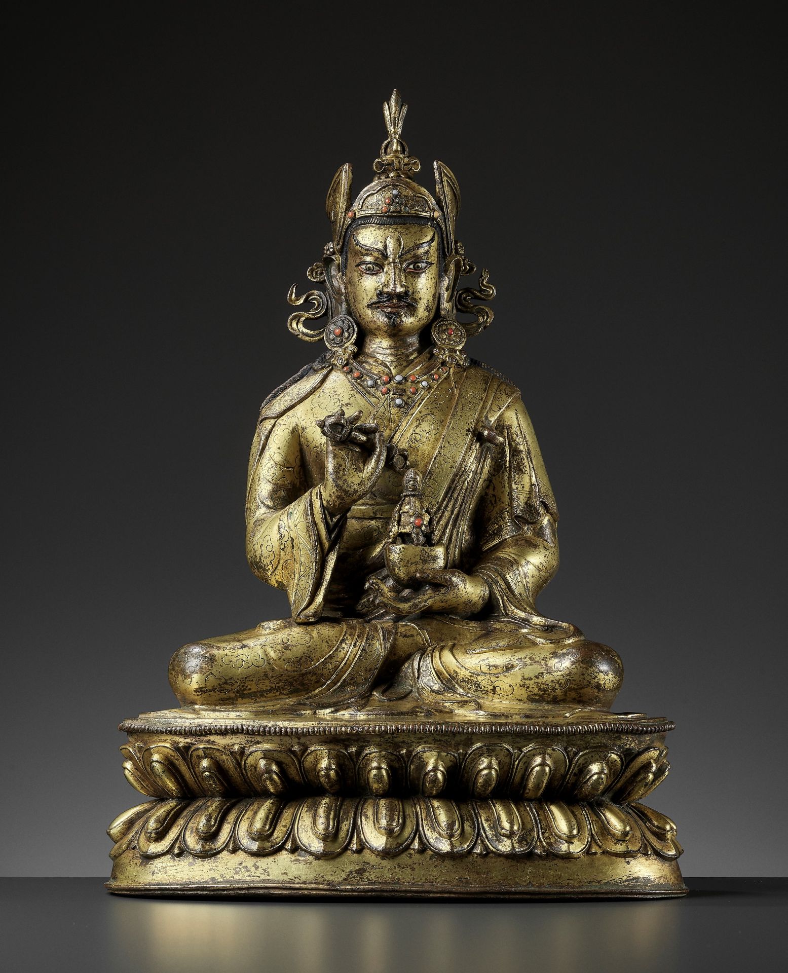 A LARGE GILT-BRONZE FIGURE OF PADMASAMBHAVA, LATE QING TO REPUBLIC