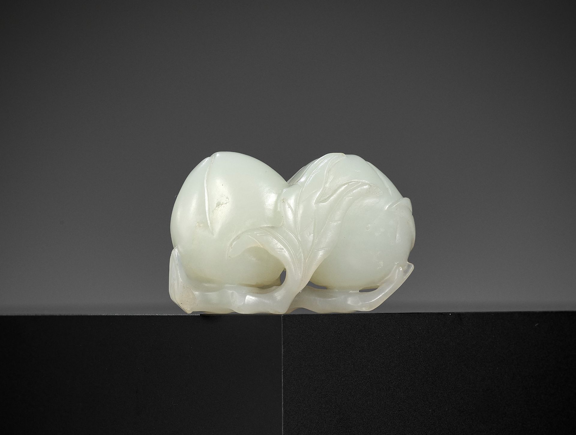 A WHITE JADE 'DOUBLE PEACH' CARVING, QING DYNASTY