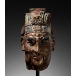 A LARGE PAINTED STUCCO HEAD OF A GUARDIAN KING, SONG TO MING DYNASTY