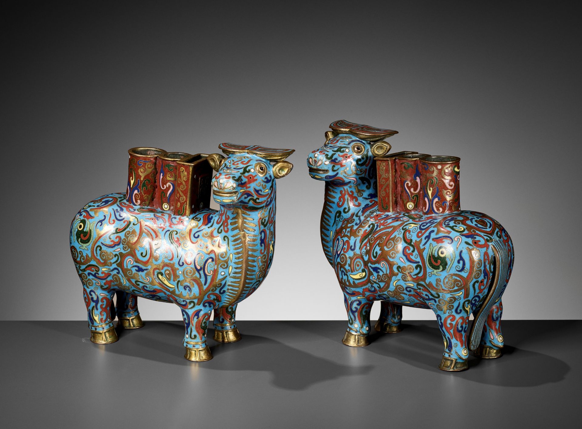 A PAIR OF CLOISONNE 'BUFFALO' JOSS STICK HOLDERS, LATE QING DYNASTY