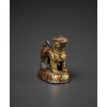 A MINIATURE GILT BRONZE LION, 16TH - 17TH CENTURY