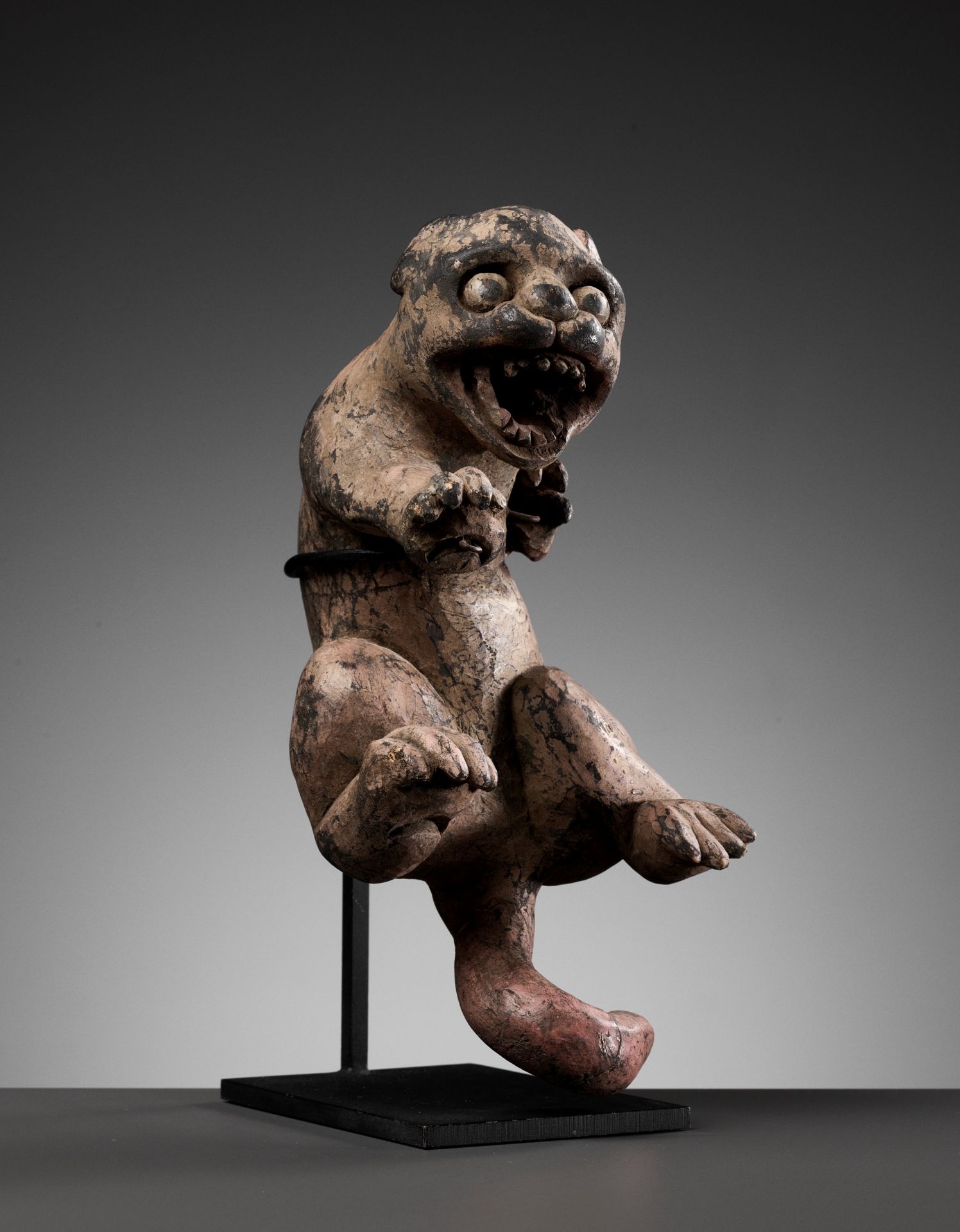 A CARVED WOOD FIGURE OF A MONGOOSE