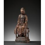 A CARVED HARDWOOD FIGURE OF BUDDHA, MING DYNASTY