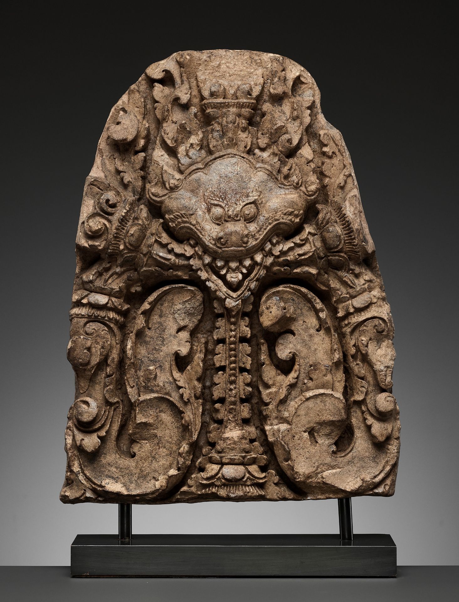 A SANDSTONE LINTEL CENTERPIECE DEPICTING A KALA, BANTEAY SREI STYLE, ANGKOR PERIOD