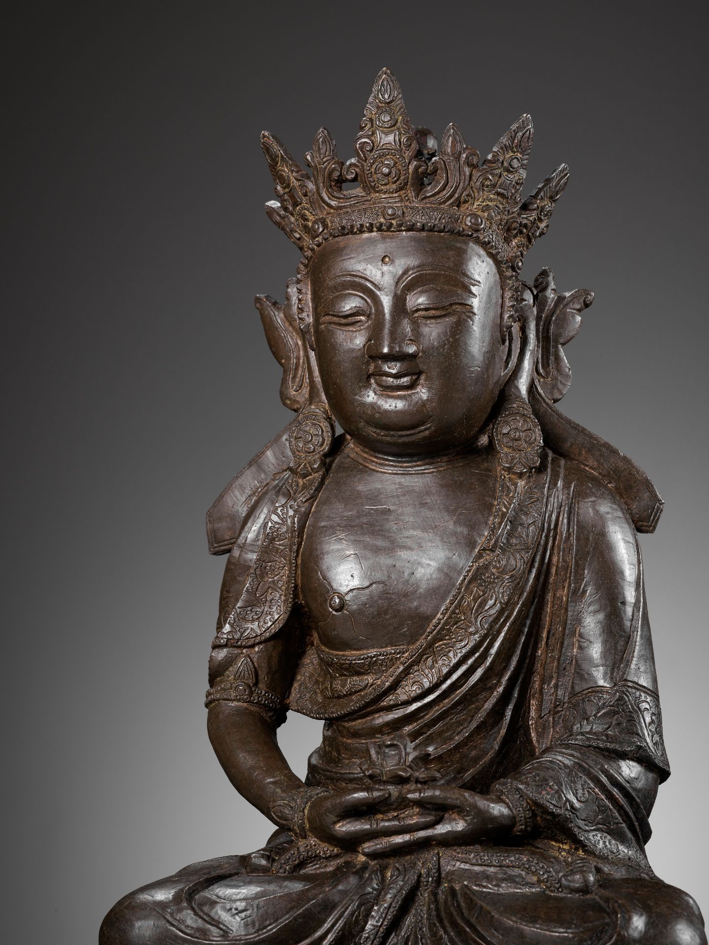 A MASSIVE BRONZE FIGURE OF AVALOKITESHVARA, DATED THIRD YEAR OF JIAJING, CORRESPONDING TO 1524