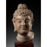 A RARE AND IMPORTANT TERRACOTTA HEAD OF BUDDHA SHAKYAMUNI