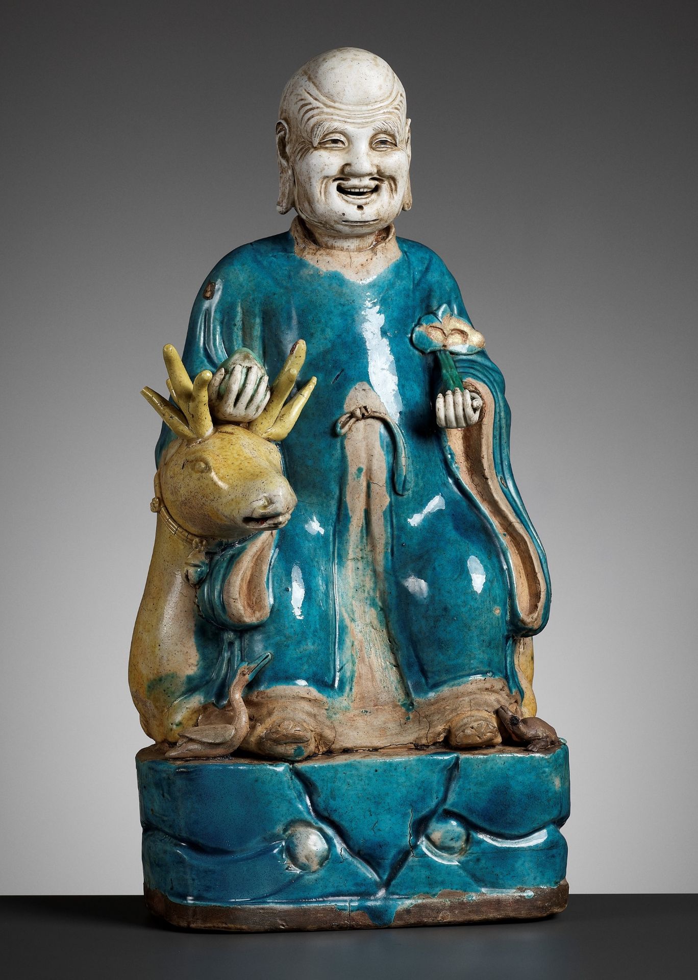 A BISCUIT-GLAZED FIGURE OF SHOULAO, 17TH - 18TH CENTURY