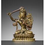 A GILT BRONZE FIGURE OF MANJUSHRI, QIANLONG