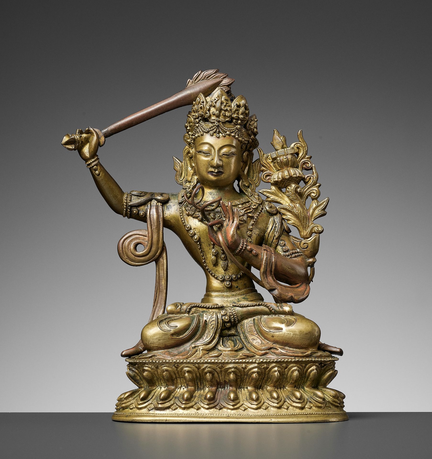 A GILT BRONZE FIGURE OF MANJUSHRI, QIANLONG