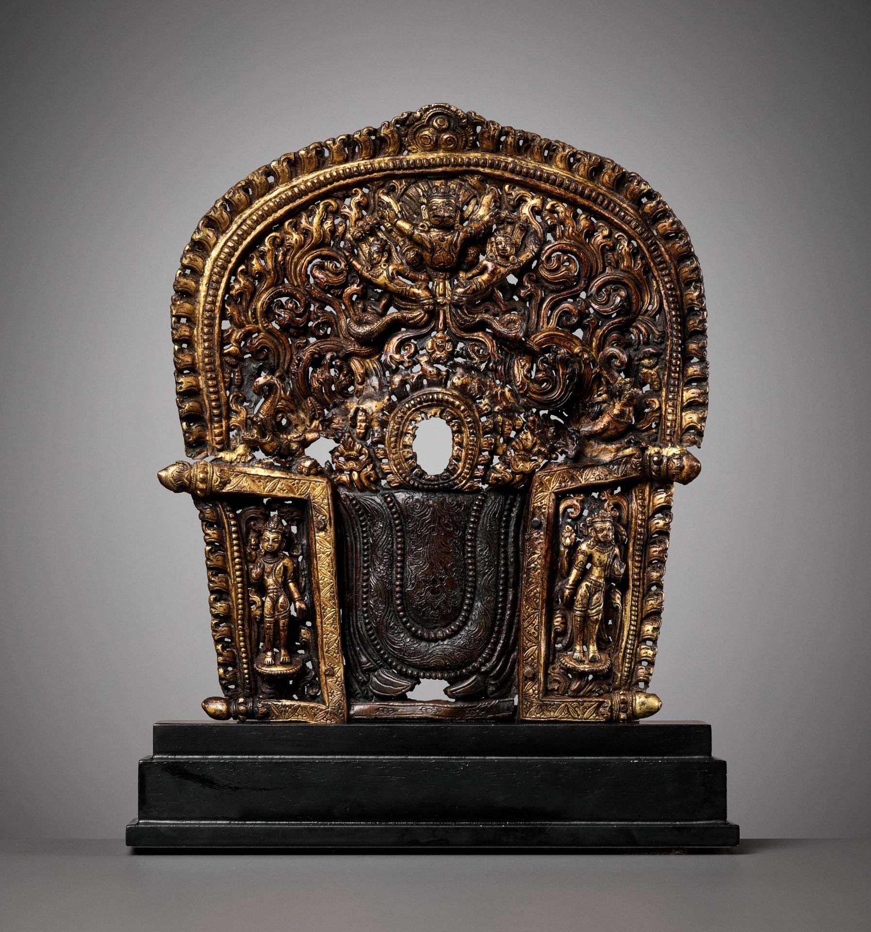 A GILT-COPPER REPOUSSE MANDORLA, 17TH CENTURY