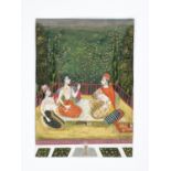 AN INDIAN MINIATURE PAINTING OF NOBLE LADIES DRINKING WINE IN A GARDEN