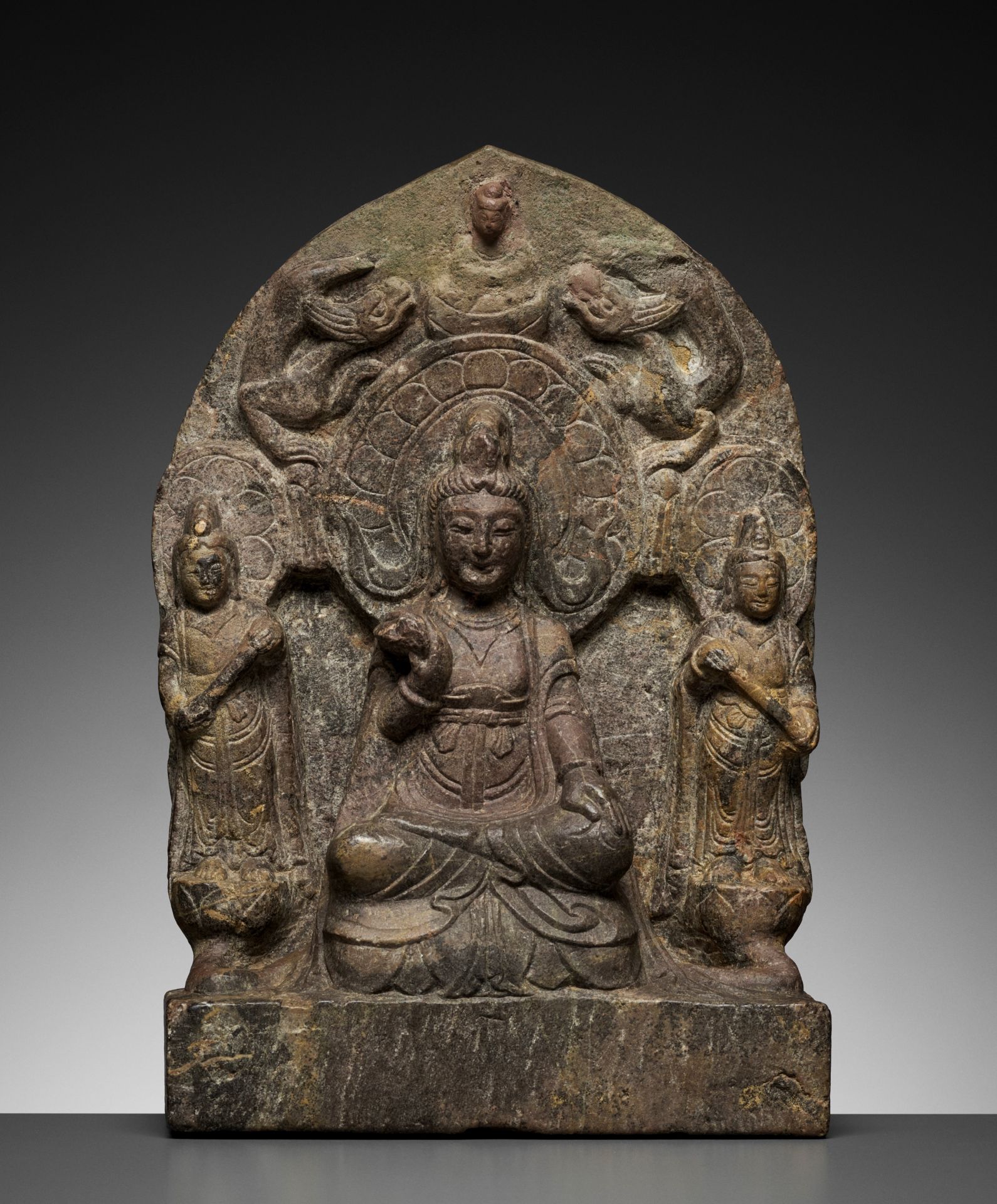 A LIMESTONE BUDDHIST TRIAD STELE OF GUANYIN, NORTHERN WEI TO TANG DYNASTY