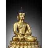 A GILT BRONZE FIGURE OF BUDDHA SHAKYAMUNI, 15TH CENTURY