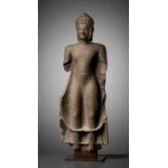 A SANDSTONE FIGURE OF BUDDHA SHAKYAMUNI, ANGKOR BOREI STYLE, PRE-ANGKOR PERIOD