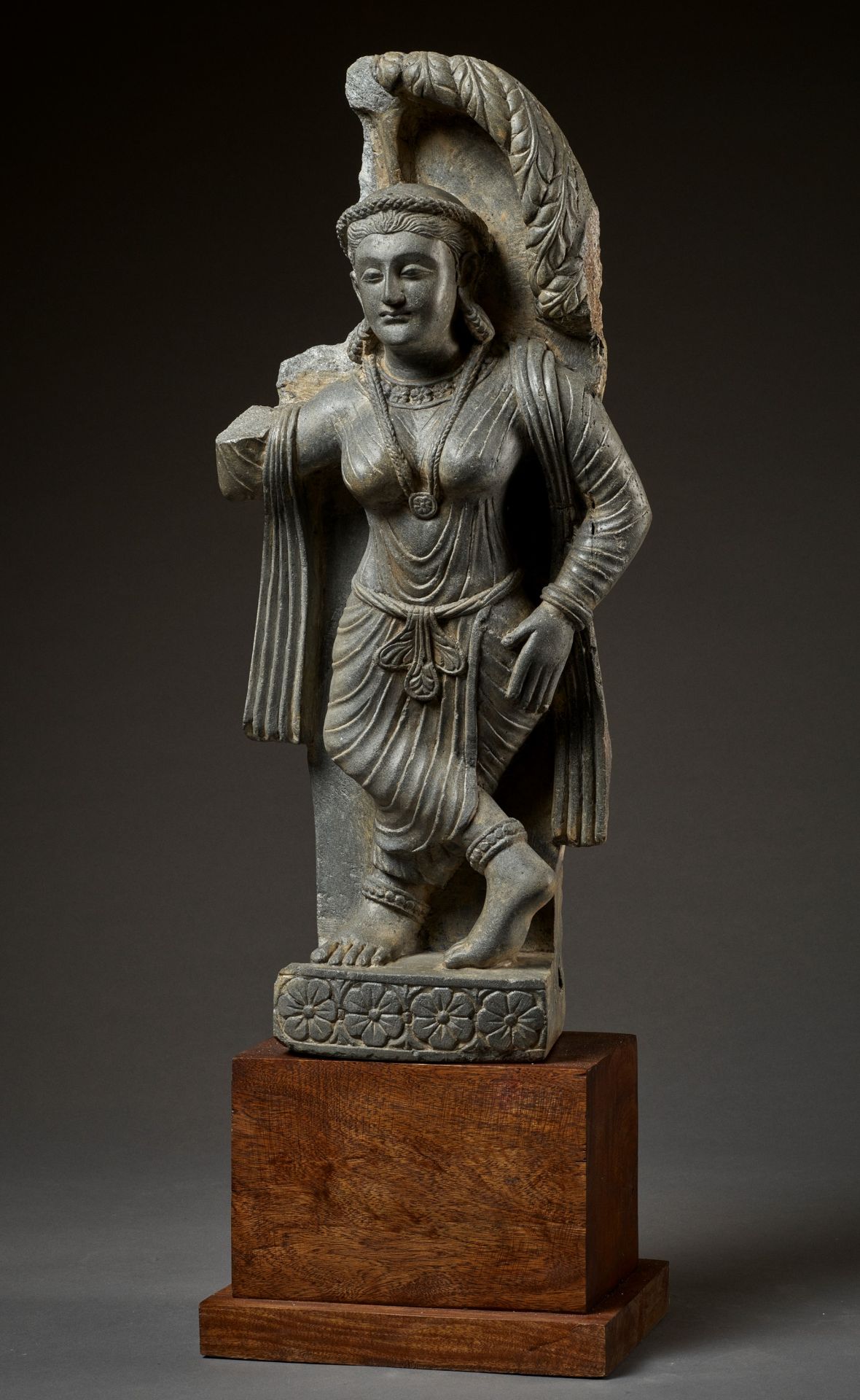 A SCHIST FIGURE OF A YAKSHI, GANDHARA, 2ND-3RD CENTURY