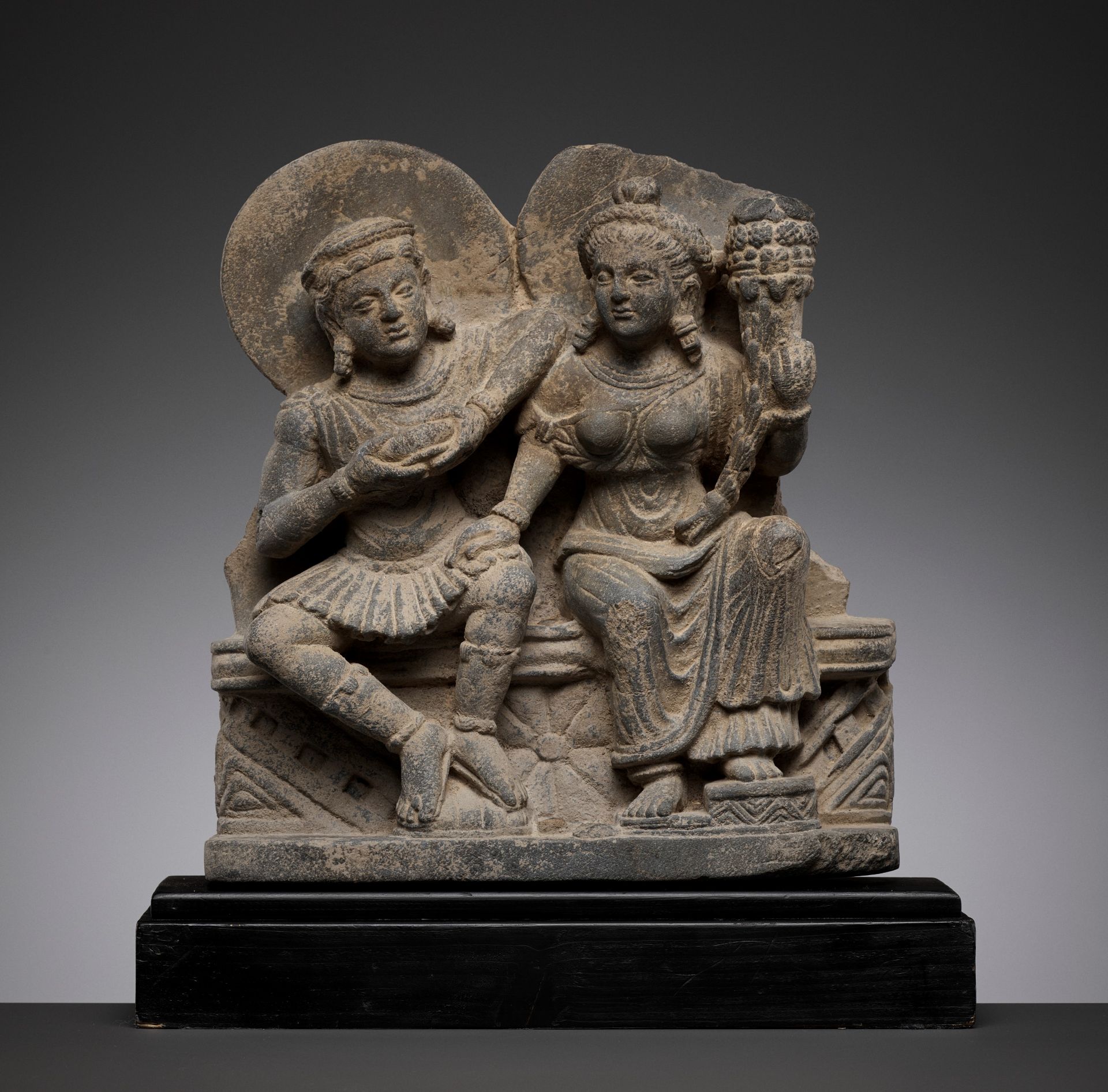 A SCHIST RELIEF DEPICTING HARITI AND PANCHIKA, KUSHAN PERIOD