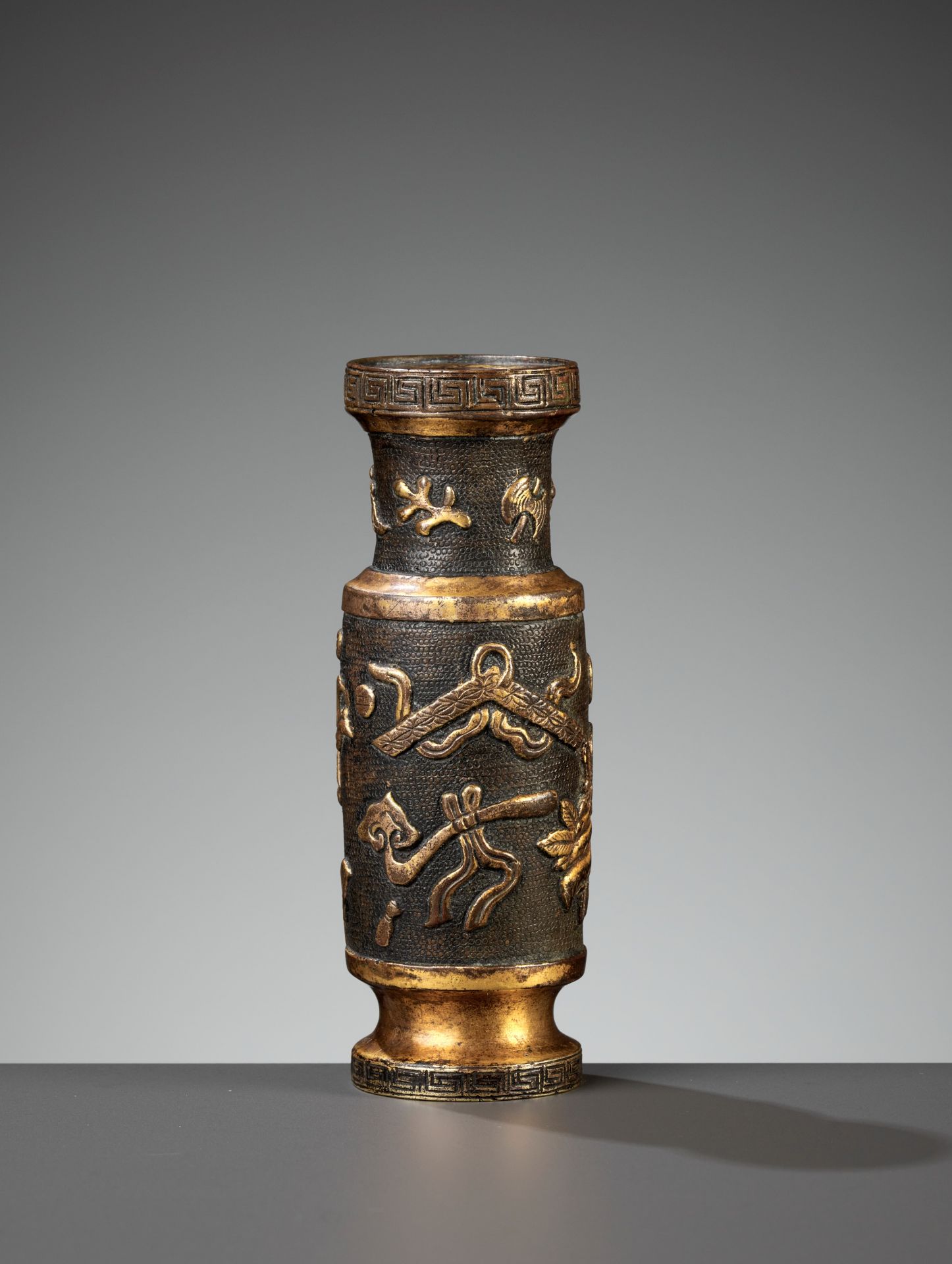 A HU WENMING PARCEL-GILT BRONZE INCENSE-TOOL VASE, MING DYNASTY