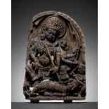 A CARVED WOOD STELE DEPICTING SHIVA SLAYING ANDHAKA, VIJAYANAGARA PERIOD