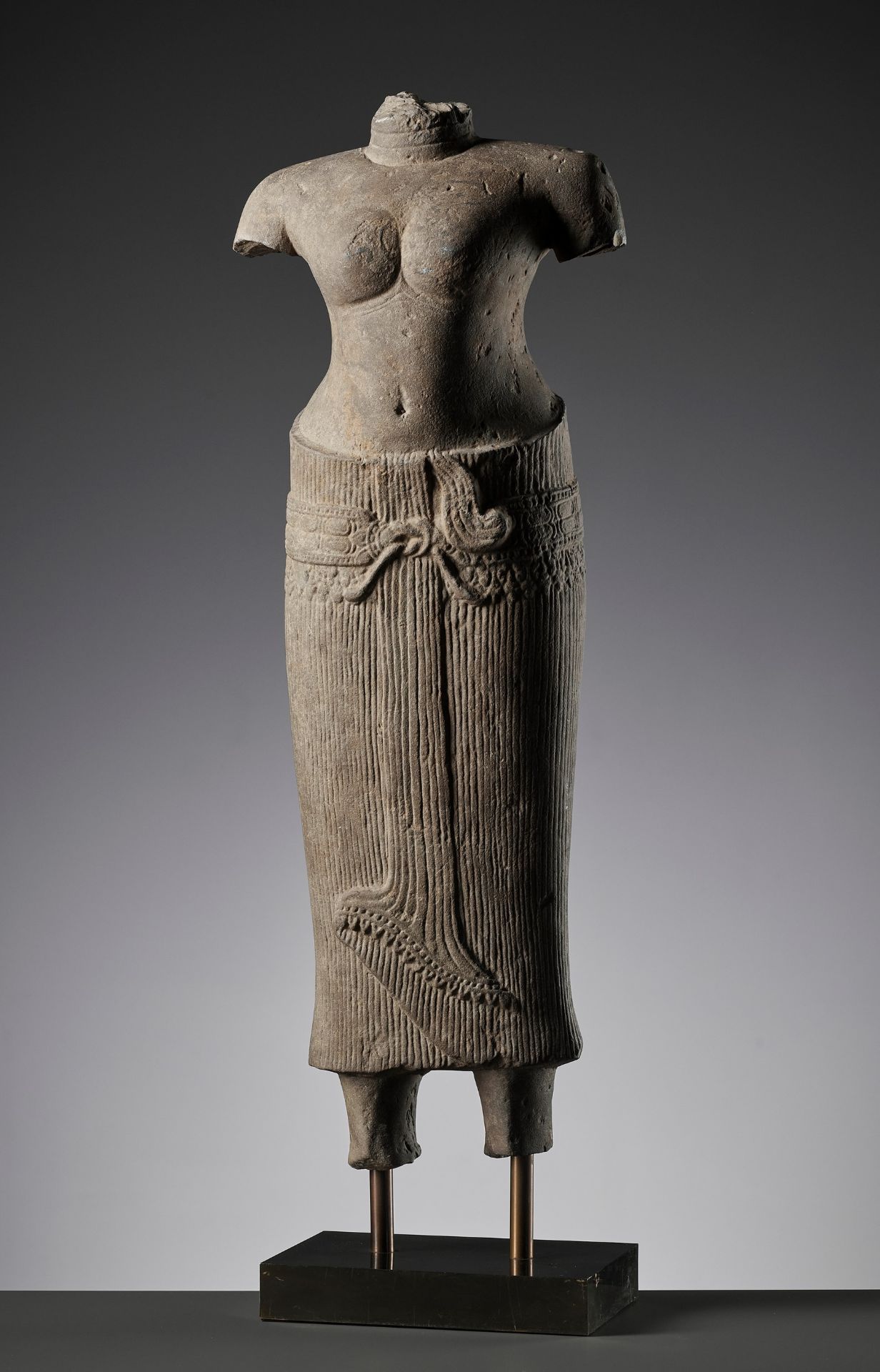 A SANDSTONE TORSO OF UMA, ANGKOR WAT PERIOD, BAPHUON STYLE