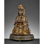 A GILT BRONZE FIGURE OF BIXIA YUANJUN, MING DYNASTY